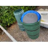 A compost bin and two water butts