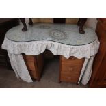 A pine kidney shaped dressing table