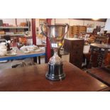 A silver plated trophy cup related to angling