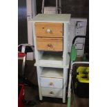 A pair of wooden bedside chests fitted two drawers