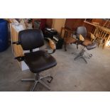 A pair of retro design swivel barbers type chairs