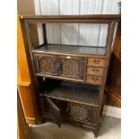 An oriental elm side cabinet fitted three drawers