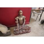 An oriental lacquer and gilt seated Buddha figure