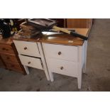 A pair of pine and painted bedside chests fitted t