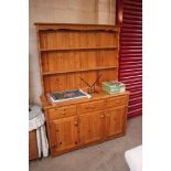 A stripped pine dresser