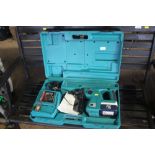 A Makita 24v cordless drill with accessories and c