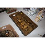 A collection of four decorative wall plaques depic