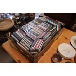 A box of various CD's