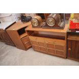 A teak cupboard fitted two drawers; and a matching