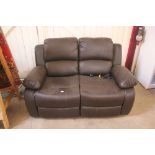 A brown leather upholstered two seater electric re