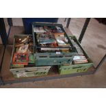Three plastic crates of various books