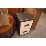 A metal two drawer filing cabinet