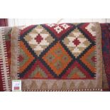 An approx. 2'10" x 2' Memana Kelim rug