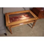 A mahogany framed table display cabinet