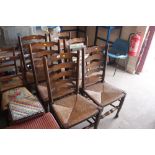 A set of six elm rush seated ladder back dining ch