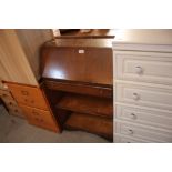 A small walnut veneered bureau