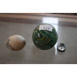 A coloured glass paperweight; an onyx egg; and a b