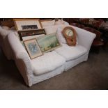 A large three seater settee with floral stamped lo