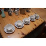 A set of five Denmark teacups and saucers
