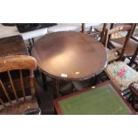 A circular mahogany window table