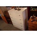 A modern white Melamine chest of five drawers
