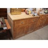 An antique stripped pine sideboard