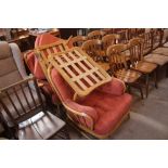 A pair of light Ercol easy chairs, with matching s