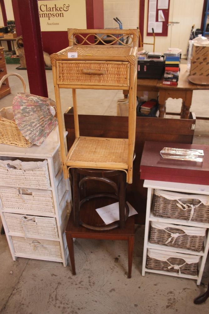 A cane and wicker bedside table; a bent wood stool