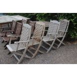 A set of four teak folding chairs