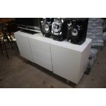 A white retro sideboard raised on metal bowed supp