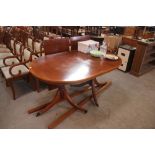 A yew wood Regency design D end extending dining t