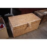 A set of three graduated wicker trunks