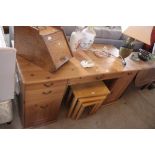 A modern pine effect pedestal desk