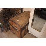 A wooden and metal bound domed storage trunk