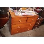 A pine chest of two short and two long drawers