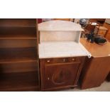 A walnut and marble topped washstand