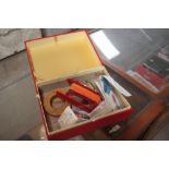 A box containing various fishing hooks, floats, we