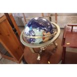 A decorative globe on swivel stand
