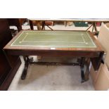 A reproduction mahogany drop leaf coffee table