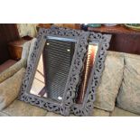 Three framed and bevelled edge wall mirrors