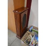 A hardwood CD/video cabinet with iron grill door