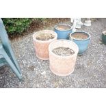 A pair of terra cotta coloured planters