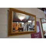 A gilt framed and bevel edged wall mirror