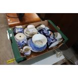 A box containing various patterned blue and white