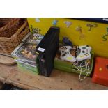An Xbox 360, various games and two controllers