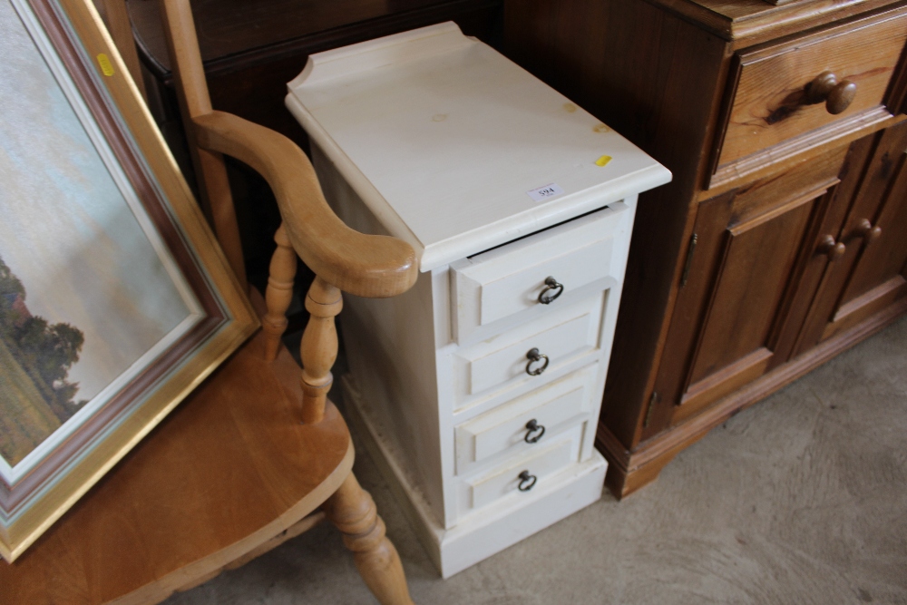 A white painted chest fitted four drawers