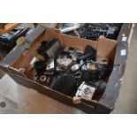 A box of various cameras and lenses