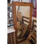 A large pine framed mirror