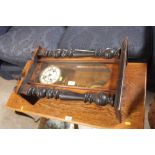 A Victorian walnut and ebonised cased wall clock