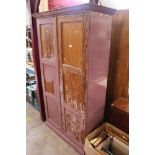 A pitch pine two door cupboard